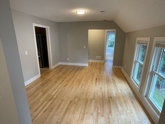 Main Room 2 looking towards Kitchen on left, rear hallway and rear room 2