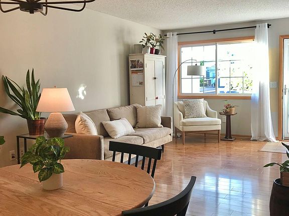 spacious living area with large front window.