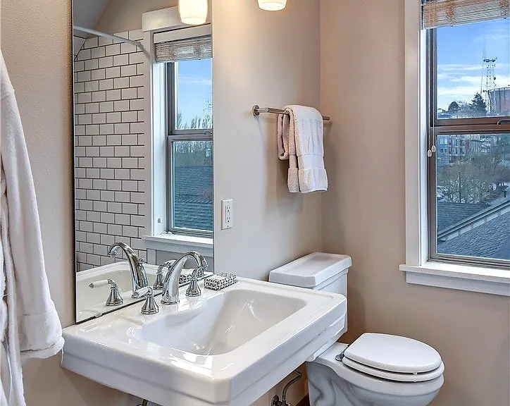 A full bathroom serves the two upper bedrooms.