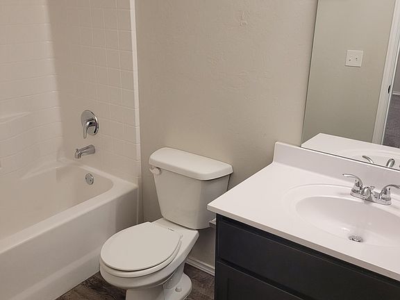 Hallway full bath near bedrooms & kitchen