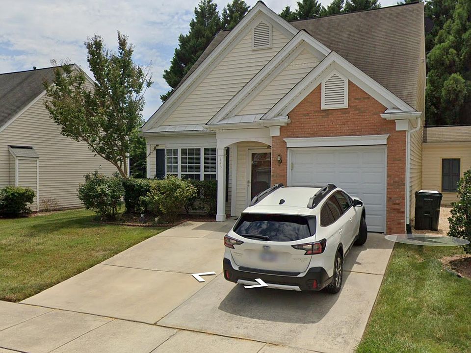 2 car driveway and 1 car garage. End unit - open space on side and back
