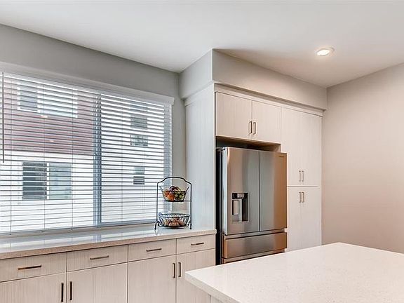 Refrigerator is included. Off to the right is the guest bathroom and laundry room. Washer & Dryer is also included.