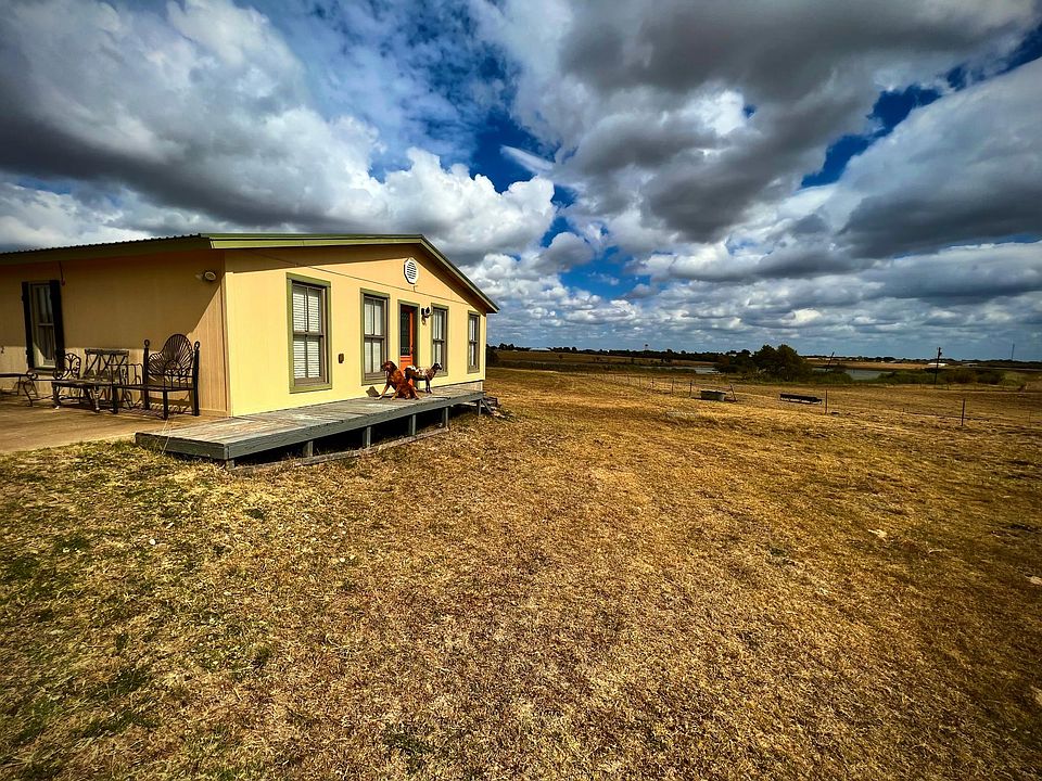 Front of guest cottage faces west with 20 mile views.