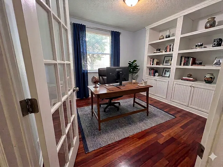 Office with French Door and Built-in Bookcase downstairs - Virtually Staged