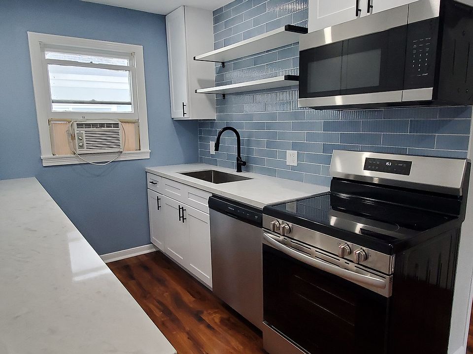 Modern kitchen with lots of counterspace and well positioned appliances.