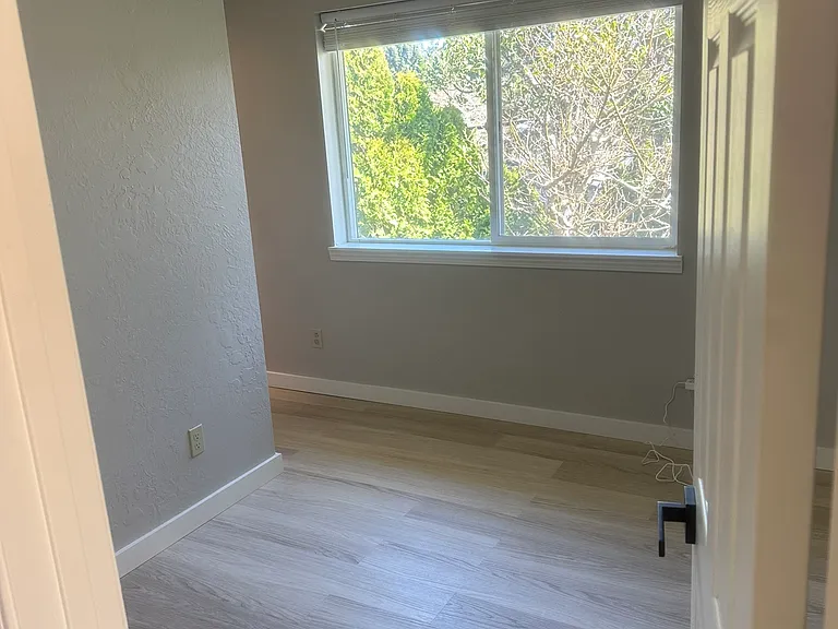 Bedroom #2 with natural light and shades