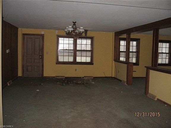 Large room off kitchen  could be used as a grand formal dining room with a living room to the right.