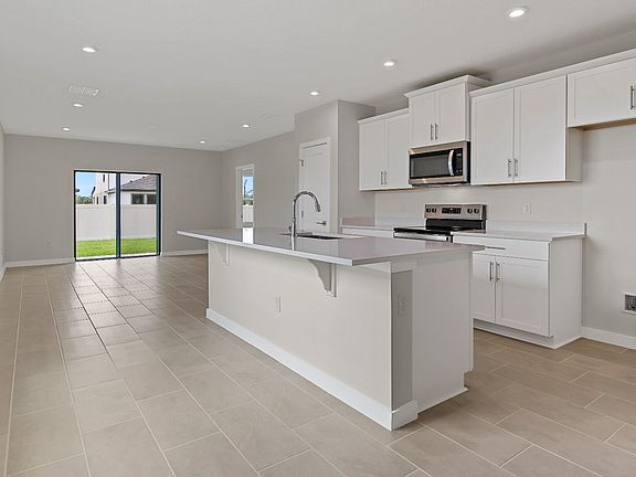The Atlantic by DRB Homes offers a bright open-concept kitchen with island seating-perfect for enter