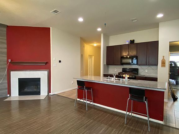Open-concept fireplace and kitchen