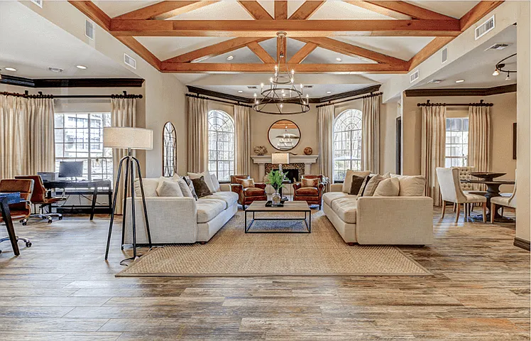 Resident Clubhouse entrance with lounge seating, fireplace, and business center