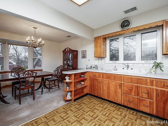 Kitchen opens to dining area