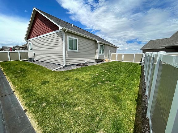 Fence has gate access to front yard that can be locked for safety & security.