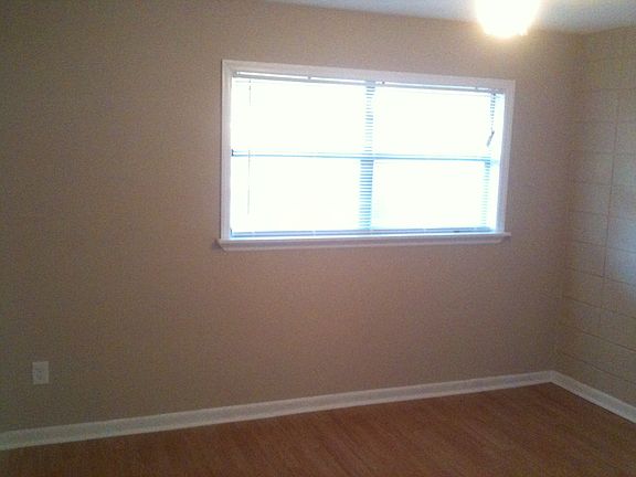 Front Bedroom, view of Window and wood floors.