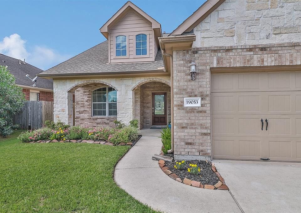 Beautiful curb appeal with a private porch and dormers just love this beautiful style and great curb appeal