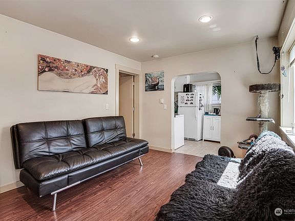 Unit 1. Easy flow between the living room and the kitchen with direct access to the patio.>