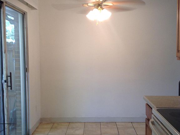 Dining Area by kitchen and sliding glass doors that open up to secluded patio area.