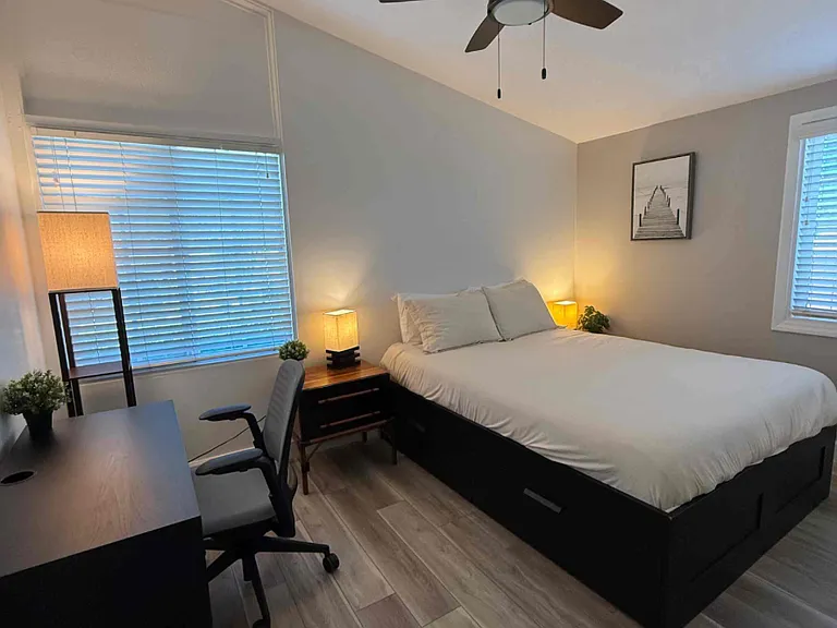 Queen bedroom 1 - optional stand up desk or sit-down, new lamp, new side tables, new closet door, new AC/heater - use with a remote control, new flooring