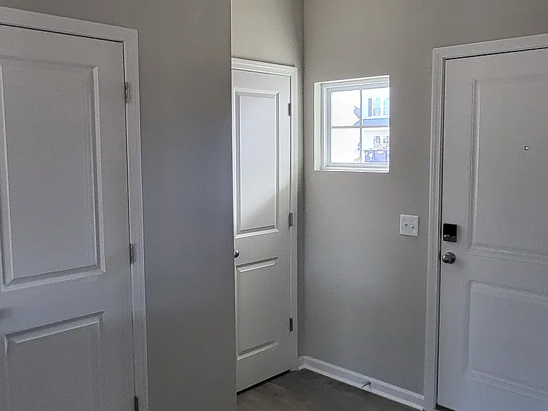 Main entry, closet and half bath