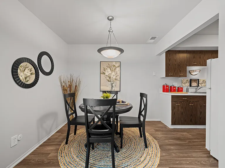 Spacious dining room area ta Knottingham Apartments in Clinton Township, MI.