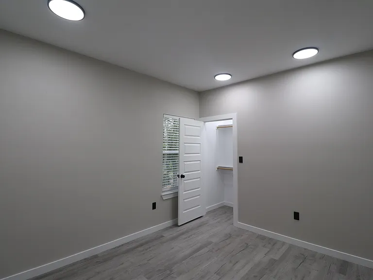 Bedroom 3 of 4 featuring modern flooring, recessed lighting, natural light, and a spacious closet.