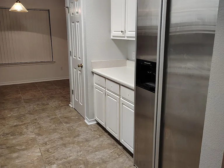 Kitchen with premium refrigerator.