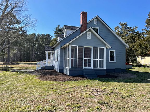 Newly screened Side porch and side entrance for comfortable outdoor seating