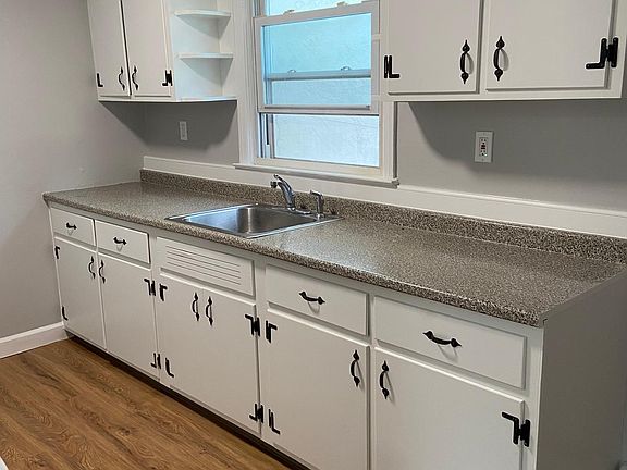 New floors and freshly done cabinets!