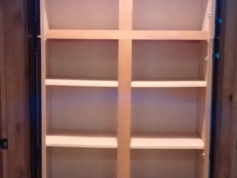 Cabinet between bedroom and bathroom