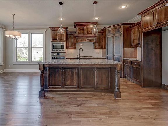 Designer chefs kitchen includes black silgranite or stainless double bowl sink with designer Kohler faucet with sprayer. Choice 