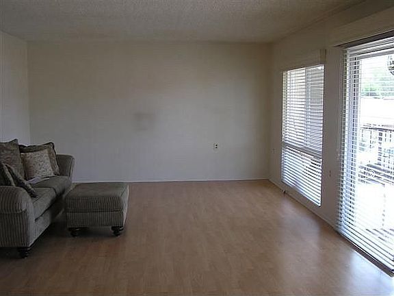 Living room with laminate floos and dual paned windows