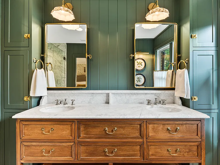 Beautiful primary bathroom attached to bedroom #1. Enjoy a spacious double vanity, huge standing shower, and lots of natural light.