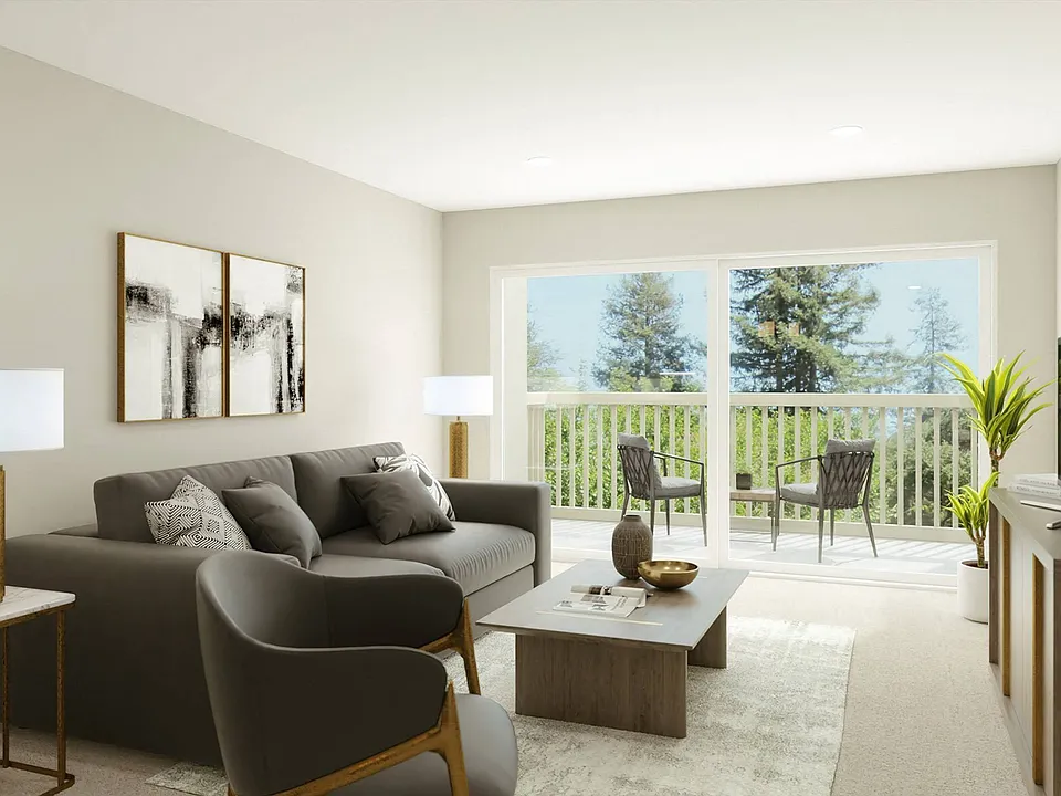 Upgraded living room with balcony at The Reserve at Prentiss Pointe Apartments in Harrison Township