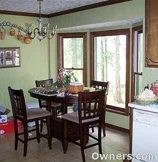 breakfast room with a bay window facing pasture
