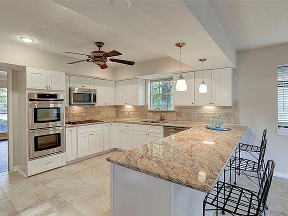 Stainless Appliances with Double Ovens, Stainless Microwave and Stainless Sink