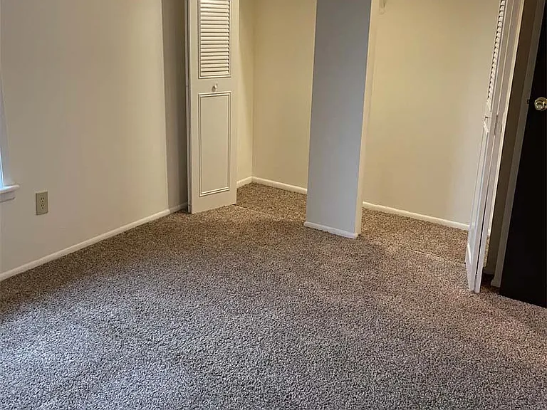 Bedroom with ample closet space at Carriage House West