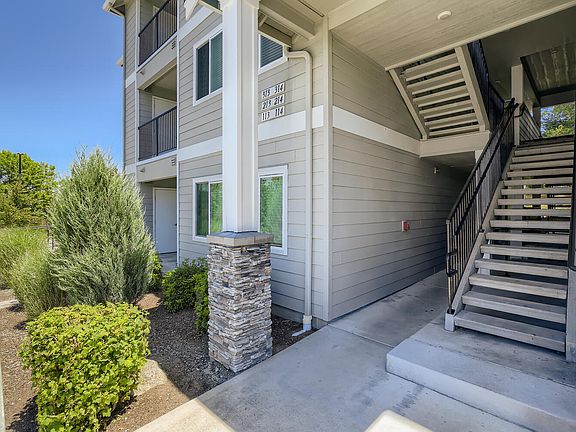 An apartment building and outdoor staircase at Huntington Place Apartments