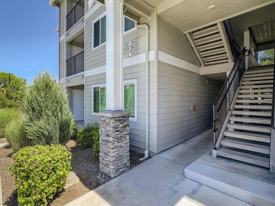 An apartment building and outdoor staircase at Huntington Place Apartments