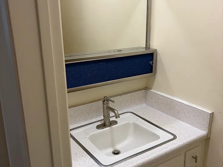 1/2 bath across from first bedroom