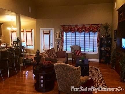 Great for Entertaining Living Room : Large living room with hardwood flooring and custom built in