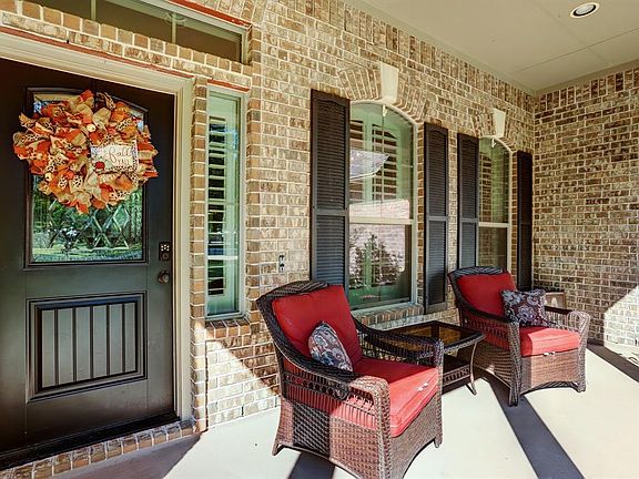 Welcoming Front porch is a great place to sit and watch the world go by or greet your neighbors. Notice the Plantation shutters?