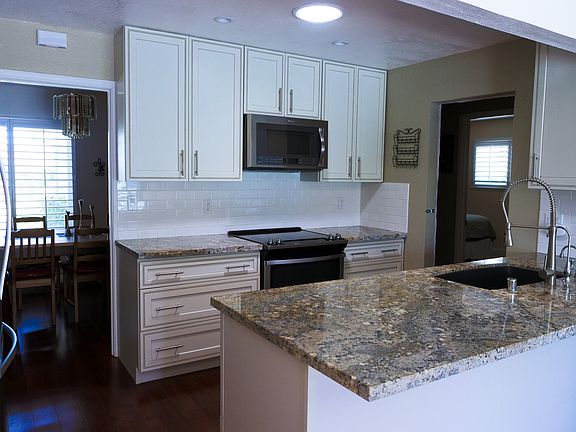 Kitchen which has reverse osmosis water filtration for the cold and hot water faucets.