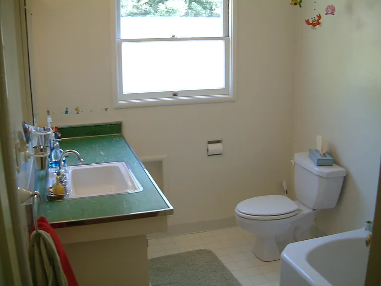 Upstairs bathroom with tub and shower