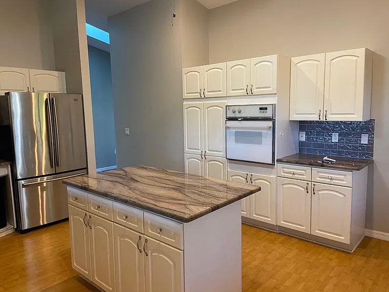Kitchen showing additional convection oven. Gas stove and oven not shown.