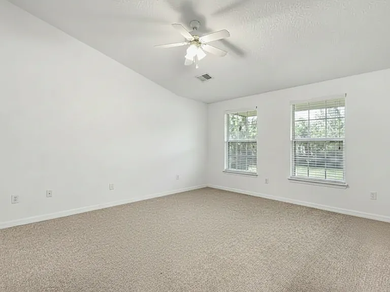 Primary bedroom (not shown: door leading to bathroom and door to walk-in closet)