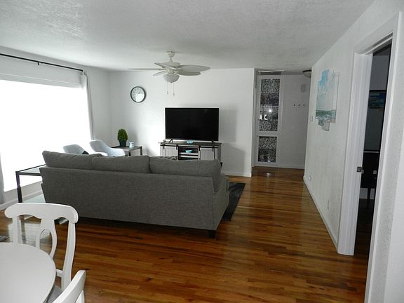 Living room. Twin beds are in the bedroom to the right.