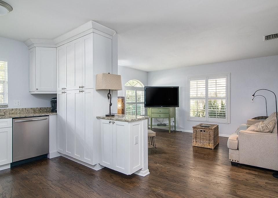 open living area include dark stained floors & NEW kitchen