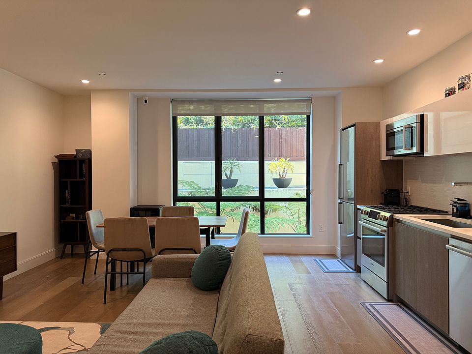 Floor to ceiling window, peaceful views and hummingbird watching.
Left shelving area has additional kitchenware.
Wine Fridge next to the windows, behind the dining table offers a small butlers pantry area.