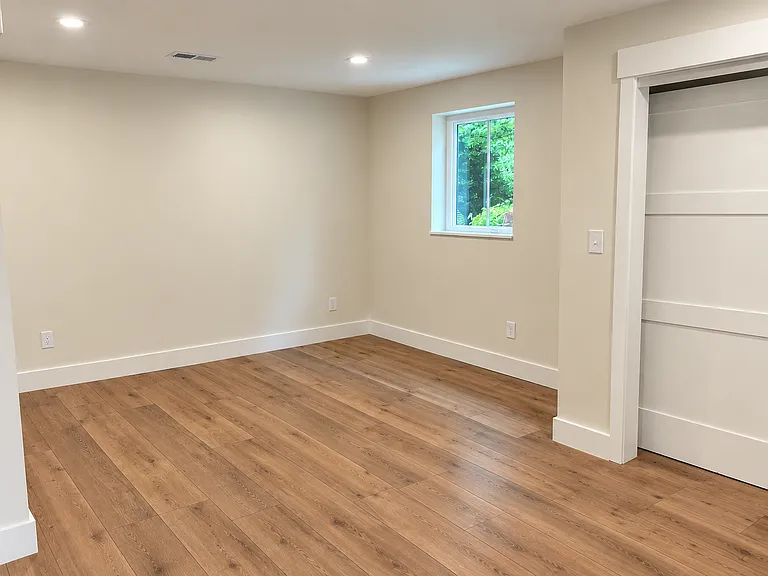 The generously sized primary bedroom layout offers plenty of space for a king-sized bed and has a large closet for storage.
