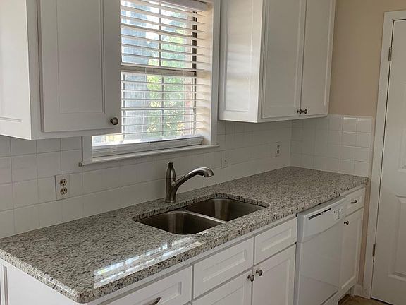 Utility room behind door in picture