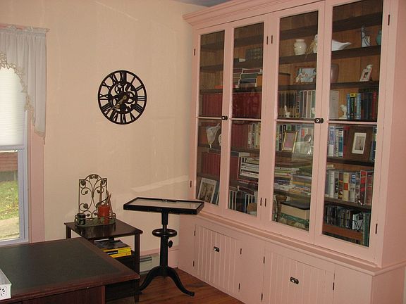 Library original built-ins & French doors to close for private or heat conserv